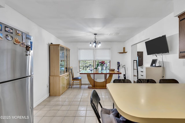 441 E Bird Village Rd, Jackson, NJ 08527 - kitchen featuring freestanding refrigerator, a chandelier, light tile patterned floors, baseboards, and pendant lighting
