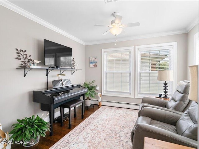 living room with baseboard heating, crown molding, dark wood-style floors, and ceiling fan