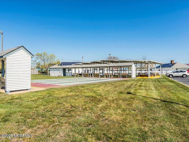 rear view of property with a yard