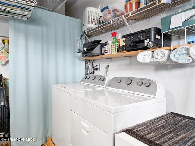 laundry area featuring washing machine and dryer