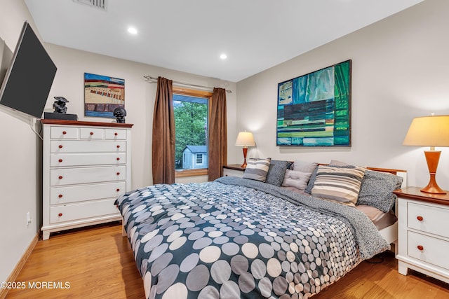 bedroom with light wood-style flooring, recessed lighting, and baseboards