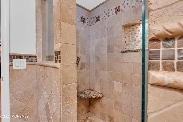 full bathroom with tiled shower