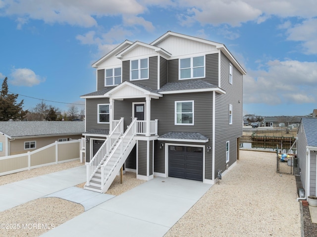 42 W Mohawk Dr, Little Egg Harbor, NJ 08087 - beach home with fence, a shingled roof, an attached garage, driveway, and stairs