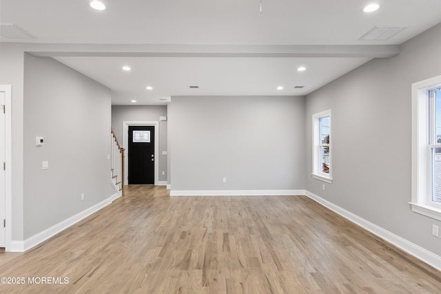 42 W Mohawk Dr, Little Egg Harbor, NJ 08087 - unfurnished living room with light wood-type flooring, stairs, recessed lighting, and baseboards
