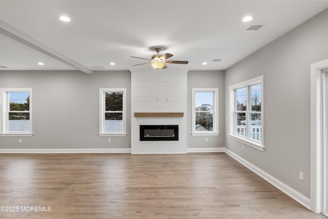 42 W Mohawk Dr, Little Egg Harbor, NJ 08087 - unfurnished living room with ceiling fan, wood finished floors, recessed lighting, a fireplace, and baseboards