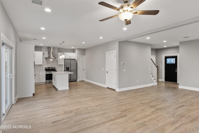 42 W Mohawk Dr, Little Egg Harbor, NJ 08087 - unfurnished living room featuring stairway, ceiling fan, light wood-style flooring, recessed lighting, and baseboards
