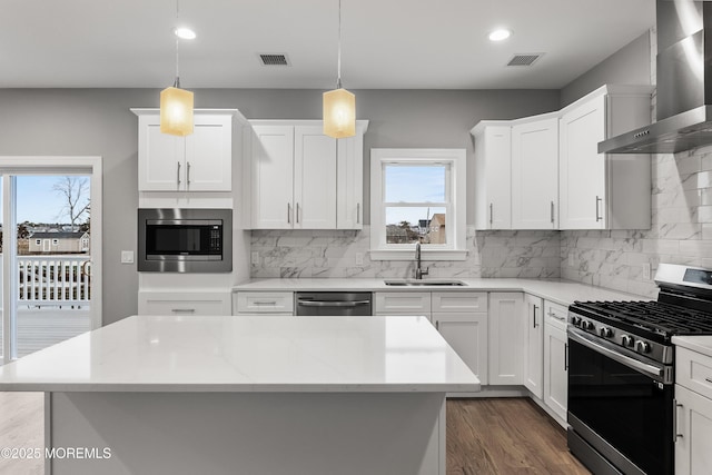 42 W Mohawk Dr, Little Egg Harbor, NJ 08087 - kitchen featuring wall chimney range hood, appliances with stainless steel finishes, a sink, plenty of natural light, and recessed lighting