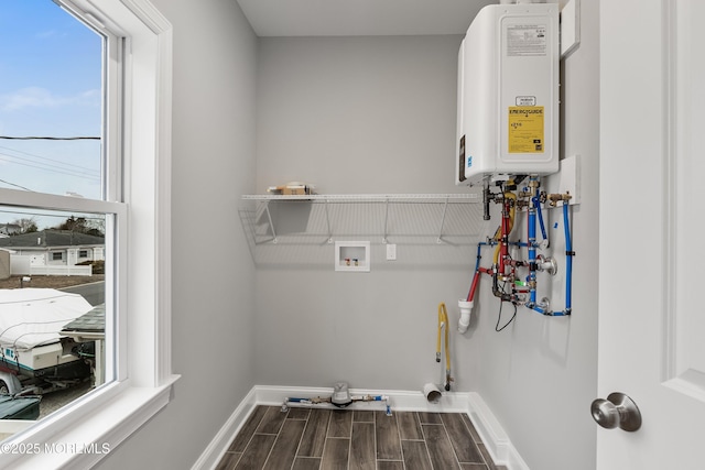 42 W Mohawk Dr, Little Egg Harbor, NJ 08087 - laundry room featuring water heater, wood finish floors, baseboards, and hookup for a washing machine