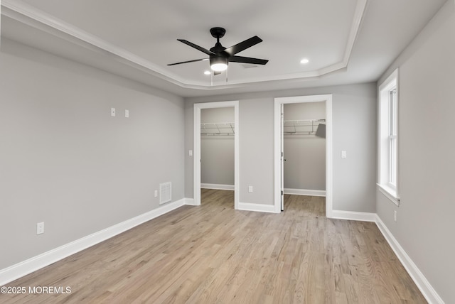 42 W Mohawk Dr, Little Egg Harbor, NJ 08087 - unfurnished bedroom featuring a tray ceiling, light wood-style flooring, baseboards, and recessed lighting