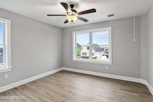42 W Mohawk Dr, Little Egg Harbor, NJ 08087 - spare room featuring wood finished floors, baseboards, and a ceiling fan