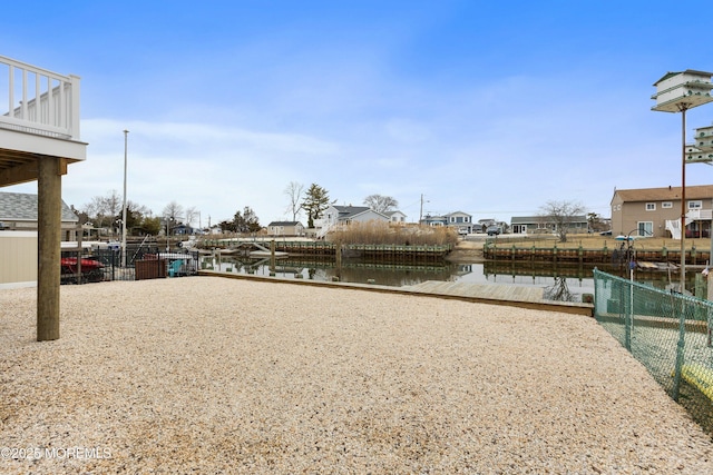 42 W Mohawk Dr, Little Egg Harbor, NJ 08087 - view of yard with a water view, fence, and a residential view