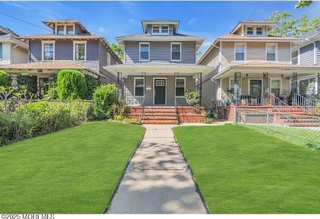 1031 3rd Ave, Asbury Park, NJ 07712 - traditional style home featuring a porch and a front yard