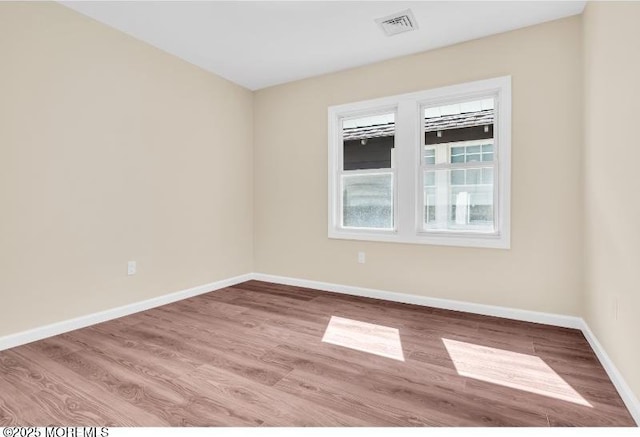 1031 3rd Ave, Asbury Park, NJ 07712 - spare room with healthy amount of natural light, wood finished floors, and baseboards