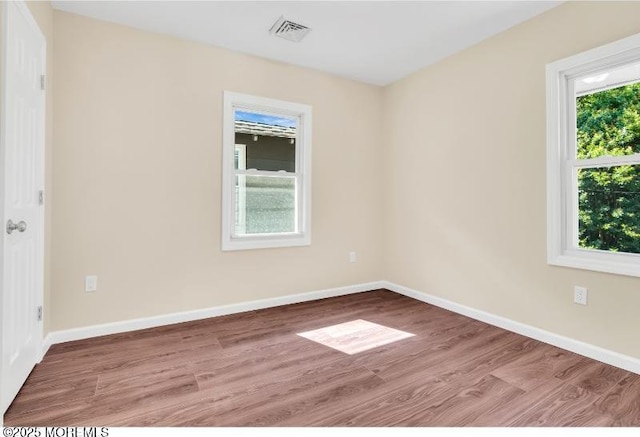 1031 3rd Ave, Asbury Park, NJ 07712 - unfurnished room with wood finished floors and baseboards