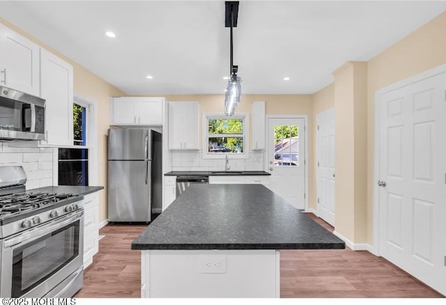 1031 3rd Ave, Asbury Park, NJ 07712 - kitchen featuring appliances with stainless steel finishes, a sink, white cabinets, tasteful backsplash, and recessed lighting