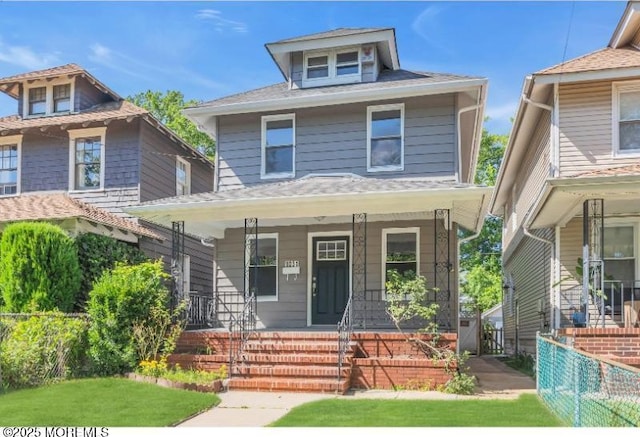 1031 3rd Ave, Asbury Park, NJ 07712 - traditional style home featuring covered porch and fence