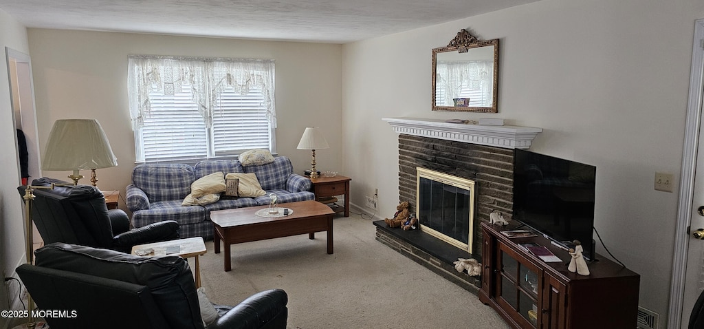carpeted living room with a brick fireplace