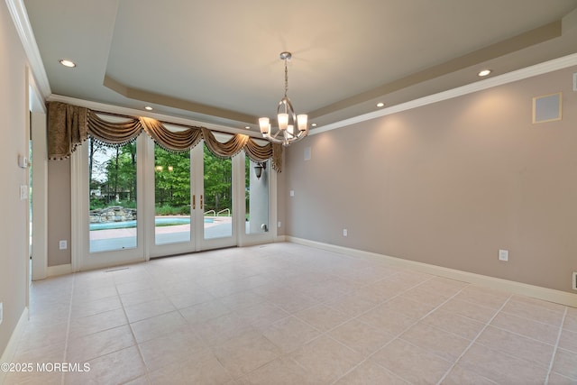 unfurnished room with a raised ceiling, ornamental molding, recessed lighting, light tile patterned flooring, and a chandelier