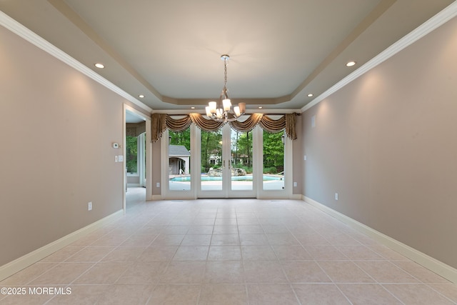 empty room with a chandelier, light tile patterned flooring, a raised ceiling, recessed lighting, and crown molding