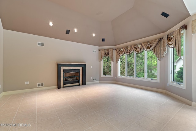 unfurnished living room featuring light tile patterned flooring, baseboards, high vaulted ceiling, a fireplace, and recessed lighting
