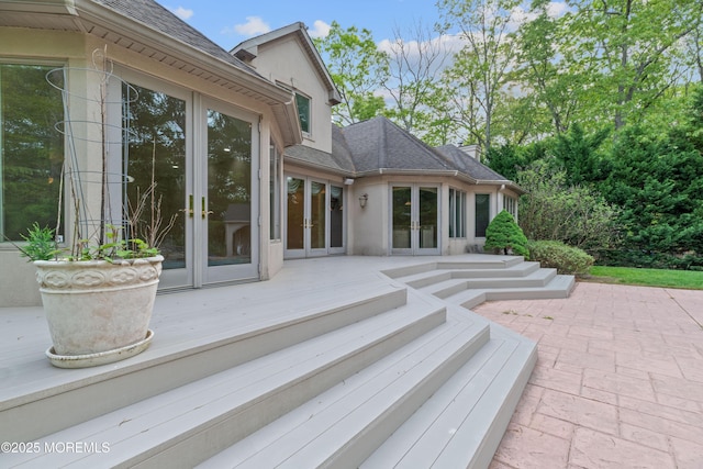 view of patio with french doors and a deck