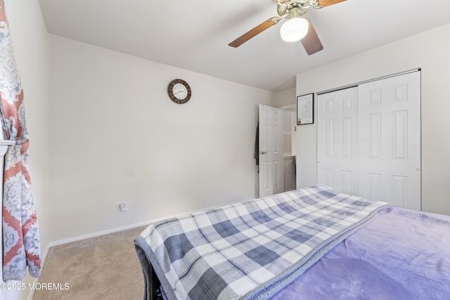 bedroom with carpet flooring, a closet, a ceiling fan, and baseboards