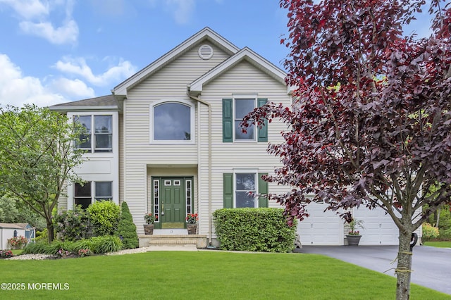 13 Dori Ln, Barnegat, NJ 08005 - view of front of home featuring concrete driveway, a front yard, and a garage