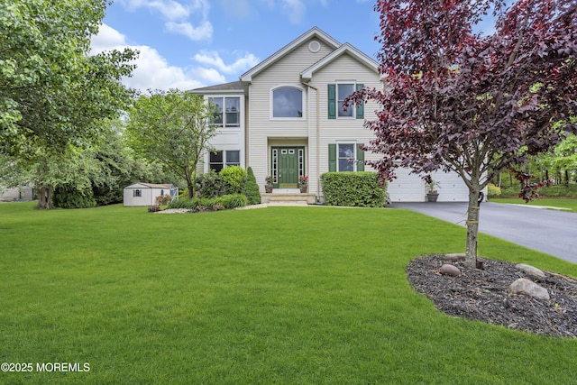 13 Dori Ln, Barnegat, NJ 08005 - view of front of home featuring a front yard, driveway, and a garage