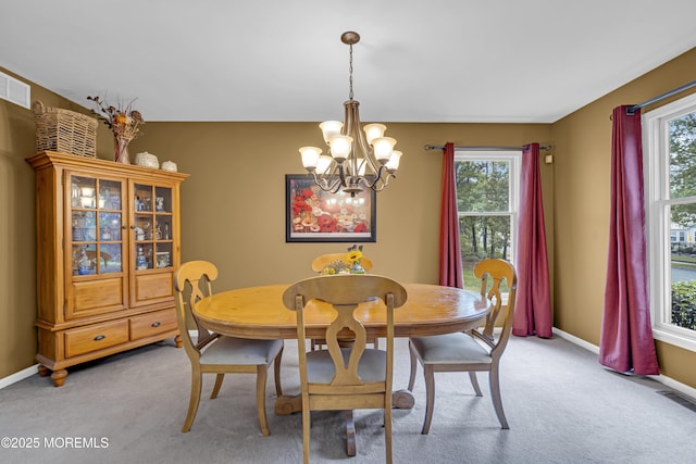 13 Dori Ln, Barnegat, NJ 08005 - dining space with a chandelier, light carpet, and healthy amount of natural light