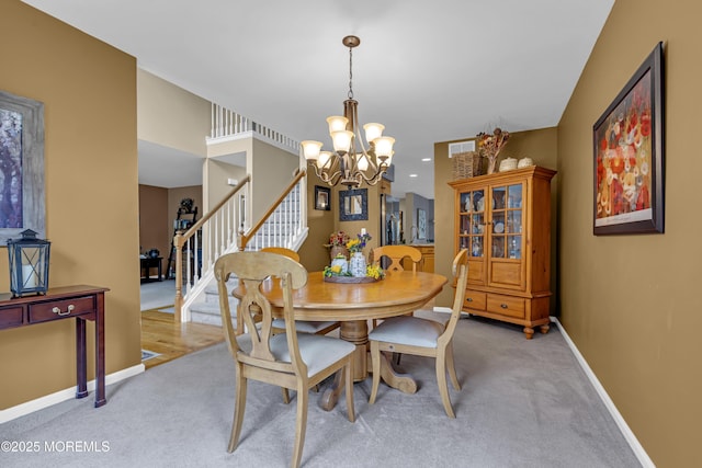 13 Dori Ln, Barnegat, NJ 08005 - dining room with stairs, a chandelier, light colored carpet, and baseboards