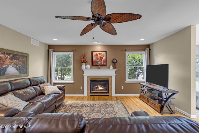 13 Dori Ln, Barnegat, NJ 08005 - living area with ceiling fan, healthy amount of natural light, a tile fireplace, wood finished floors, and recessed lighting