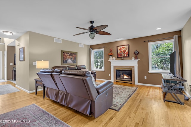 13 Dori Ln, Barnegat, NJ 08005 - living area with a tile fireplace, a ceiling fan, light wood finished floors, plenty of natural light, and recessed lighting