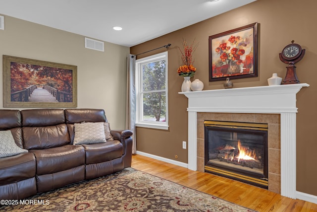 13 Dori Ln, Barnegat, NJ 08005 - living room with wood finished floors, a tiled fireplace, baseboards, and recessed lighting