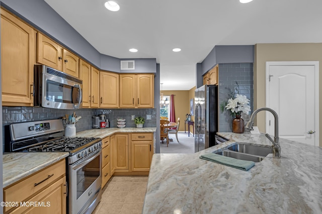 13 Dori Ln, Barnegat, NJ 08005 - kitchen featuring stainless steel appliances, a sink, light stone counters, backsplash, and recessed lighting