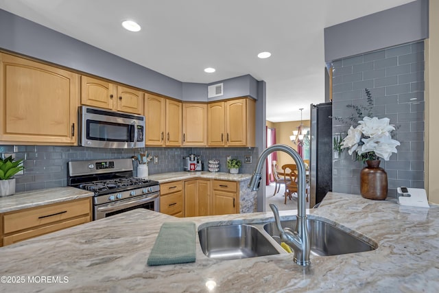 13 Dori Ln, Barnegat, NJ 08005 - kitchen with appliances with stainless steel finishes, a sink, light stone countertops, tasteful backsplash, and light brown cabinets