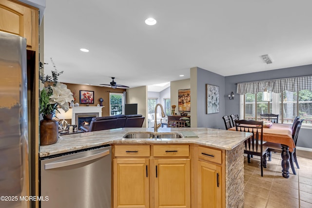 13 Dori Ln, Barnegat, NJ 08005 - kitchen featuring appliances with stainless steel finishes, a sink, a ceiling fan, open floor plan, and a lit fireplace