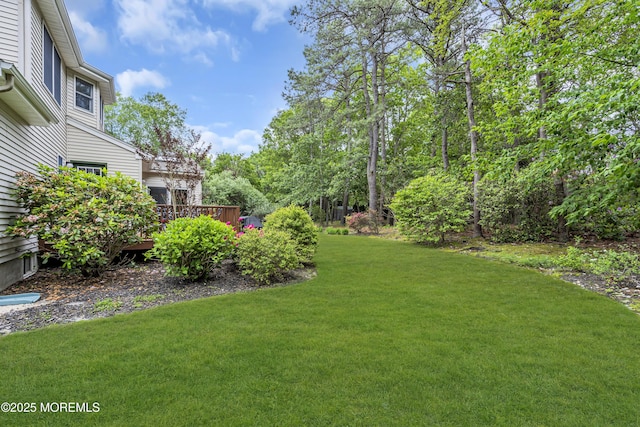 13 Dori Ln, Barnegat, NJ 08005 - view of green lawn with a wooden deck