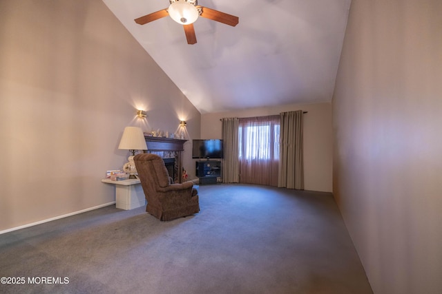 sitting room with ceiling fan, a fireplace, carpet floors, and high vaulted ceiling