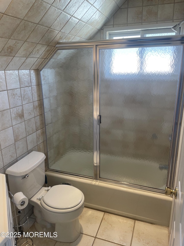 100 Vance Ave, Lavallette, NJ 08735 - full bathroom featuring tile patterned floors, enclosed tub / shower combo, toilet, lofted ceiling, and tile walls