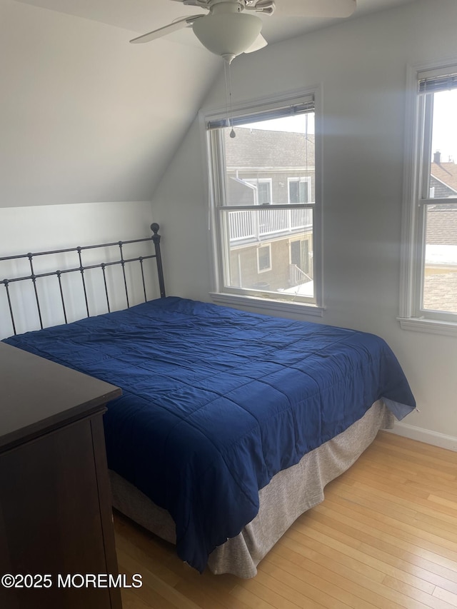 100 Vance Ave, Lavallette, NJ 08735 - bedroom featuring wood finished floors, vaulted ceiling, baseboards, and a ceiling fan