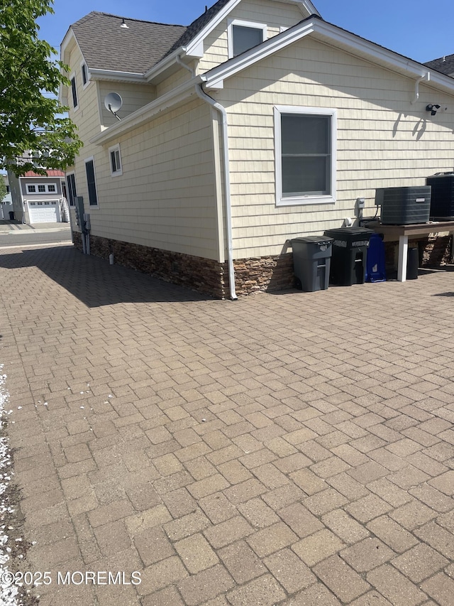 100 Vance Ave, Lavallette, NJ 08735 - view of home's exterior with central air condition unit and roof with shingles