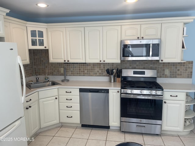 100 Vance Ave, Lavallette, NJ 08735 - kitchen featuring appliances with stainless steel finishes, open shelves, a sink, light tile patterned floors, and recessed lighting