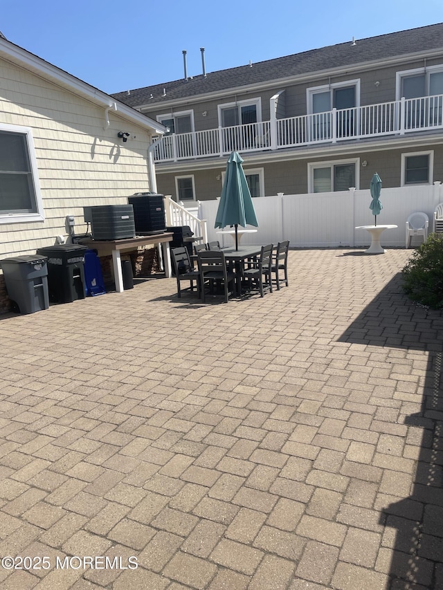 100 Vance Ave, Lavallette, NJ 08735 - view of patio featuring outdoor dining space, cooling unit, and fence