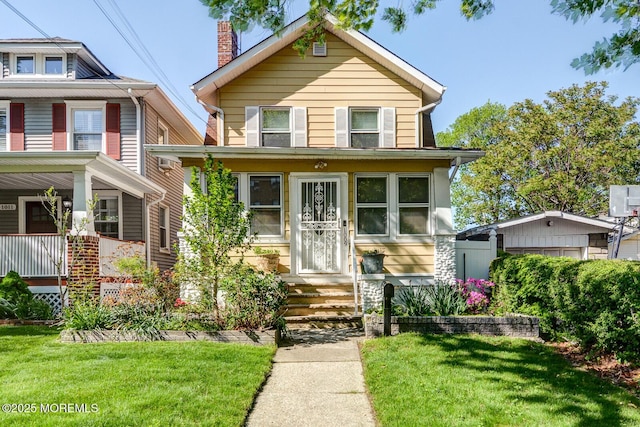 view of front of house with a front lawn and a chimney