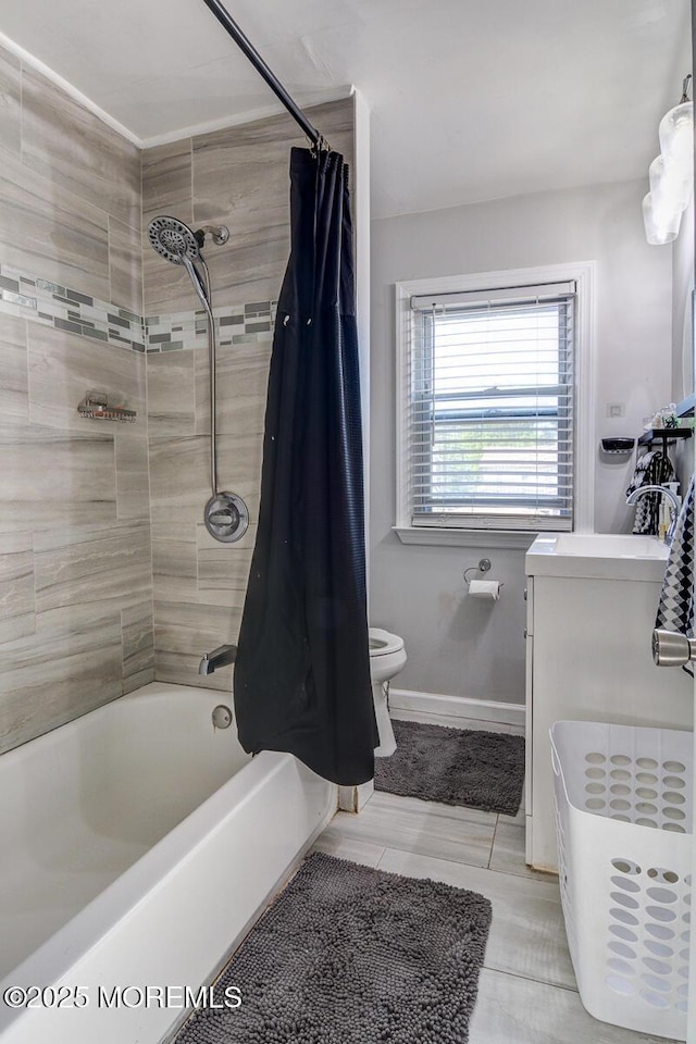 full bath with toilet, shower / bath combination with curtain, tile patterned floors, and baseboards