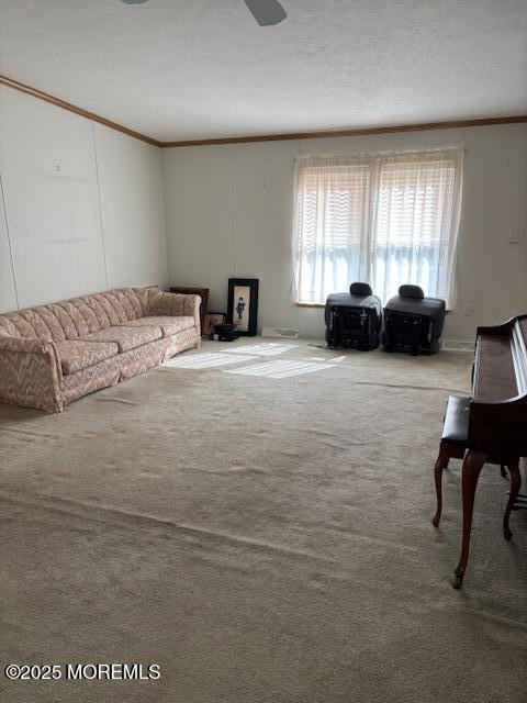 carpeted living area featuring crown molding