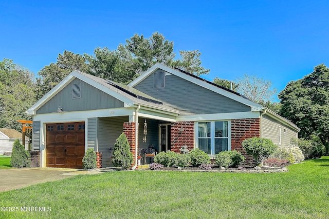 23 Lambeth Ln, Manchester, NJ 08759 - view of front facade with a front yard, an attached garage, driveway, and brick siding