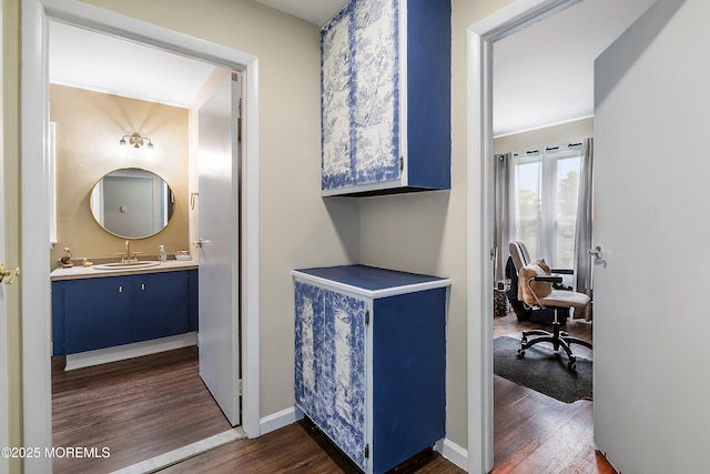 23 Lambeth Ln, Manchester, NJ 08759 - hall featuring dark wood-style floors, a sink, an office area, and baseboards