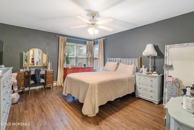 23 Lambeth Ln, Manchester, NJ 08759 - bedroom featuring wood finished floors, an office area, a ceiling fan, and a baseboard radiator