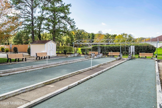 23 Lambeth Ln, Manchester, NJ 08759 - surrounding community featuring a game area, fence, a storage unit, and an outbuilding